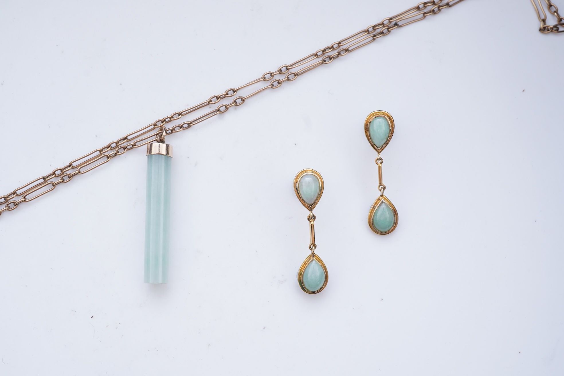 A jadeite pendant and pair of earrings